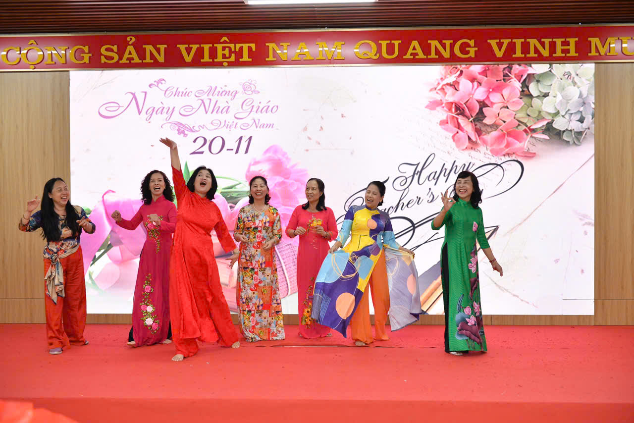 A group of women performing on a stage
Description automatically generated