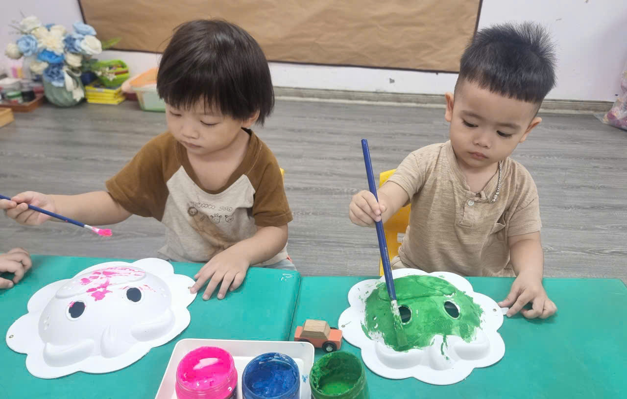 A couple of young boys painting
AI-generated content may be incorrect.